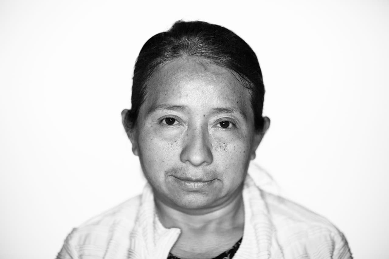 28 years in the USA. She arrived from Guatemala in 1989. Her husband was deported five years ago. Now she cares for her five American children alone. She worries that with the new regulations her children will lose the benefits of public assistance and, if she were deported, her children would be left without parents in their own country.