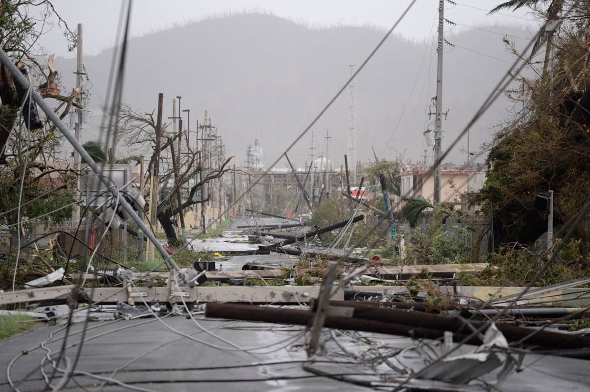 The road is blocked by downed power lines in Humacoa, in the east of the island. They currently pose no risk as power is out throughout the island. Photo: Carlos Giusti/AP