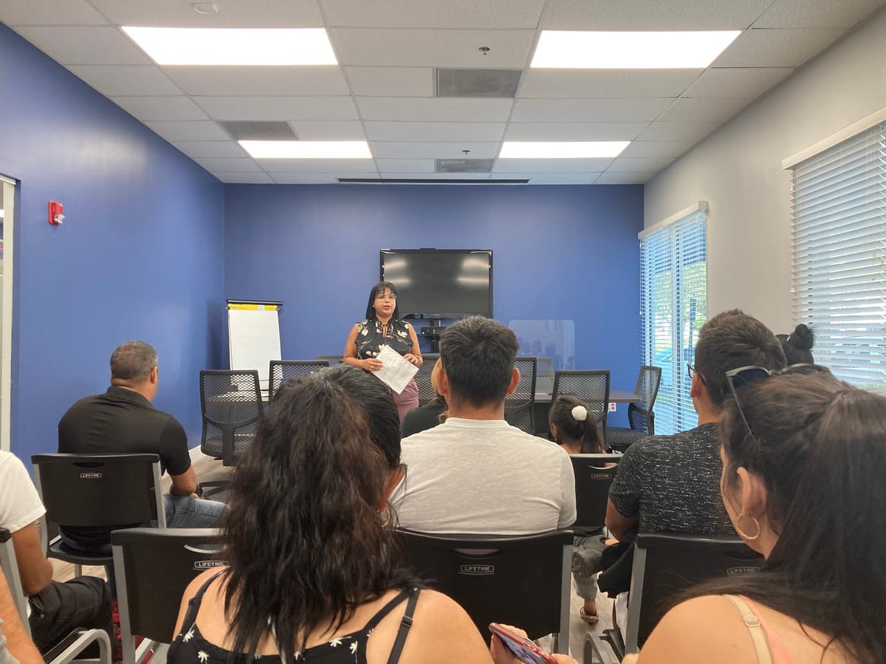 Recently arrived migrants receive orientation at the offices of Church World Servce in Doral, Florida.
