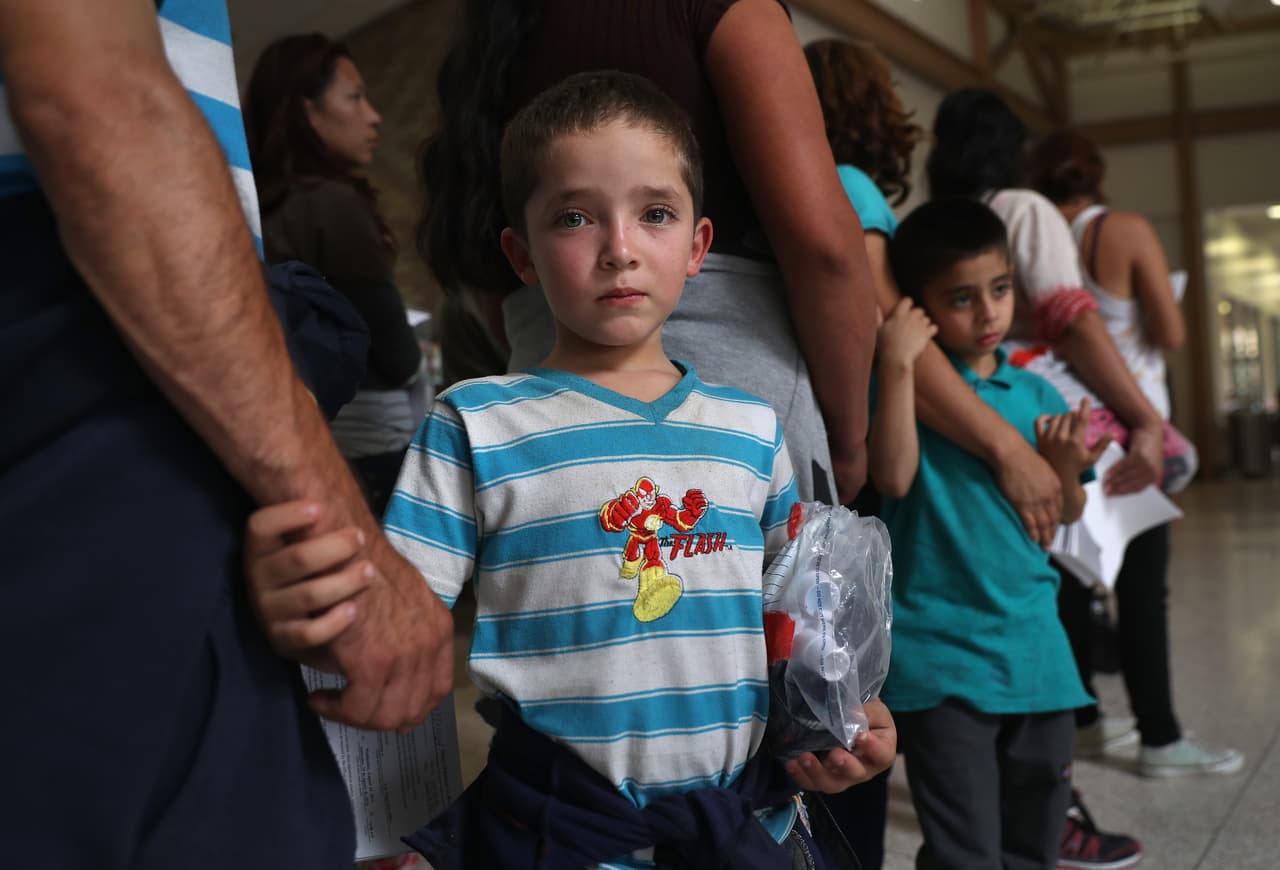 Brian Alexander, a 7-year-old from Honduras, waits for a bus with his father after being processed by Border Patrol. According to the federal agency, between October and November 2015 about 5,000 unaccompanied minors and a similar number of families (parents or adults accompanying a child) were detained. That's almost twice as many detentions as in 2014.