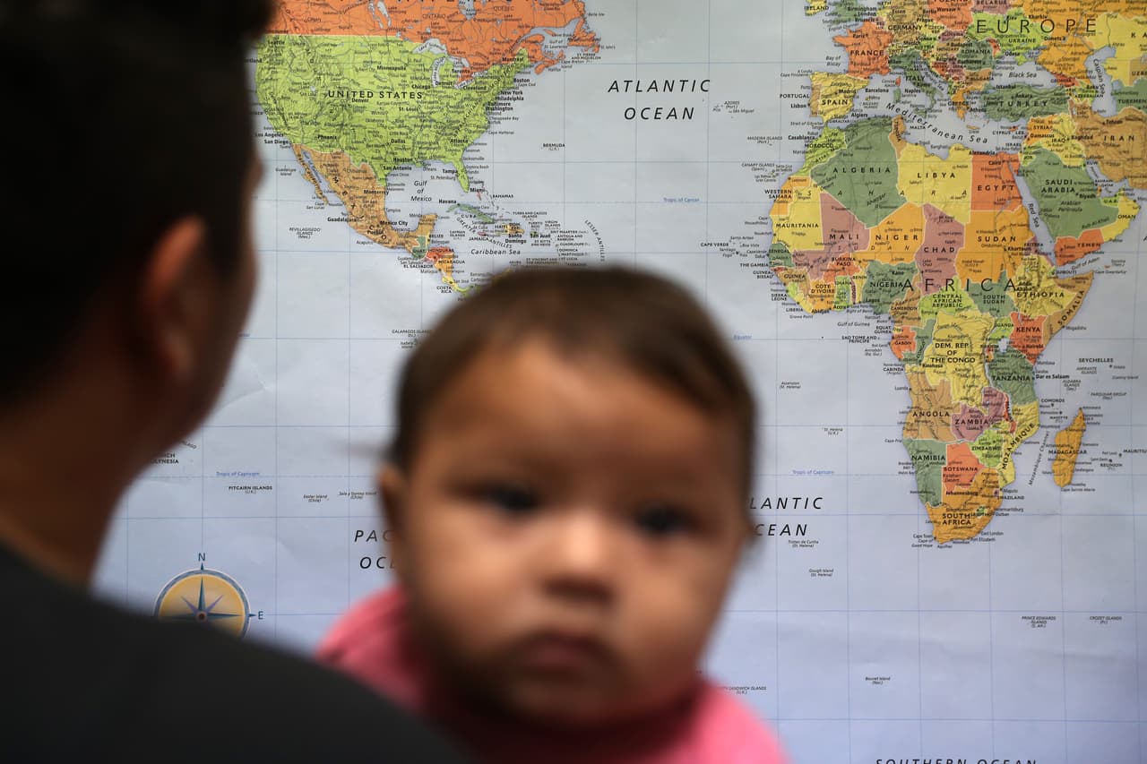 Lone Monserrat, born 7 months ago in Honduras, waits with his father in an immigrant assistance center in McAllen, Texas. Central American immigrants and asylum seekers who entered the country after January 1, 2014, are deportation priorities under the Obama administration's latest policy.