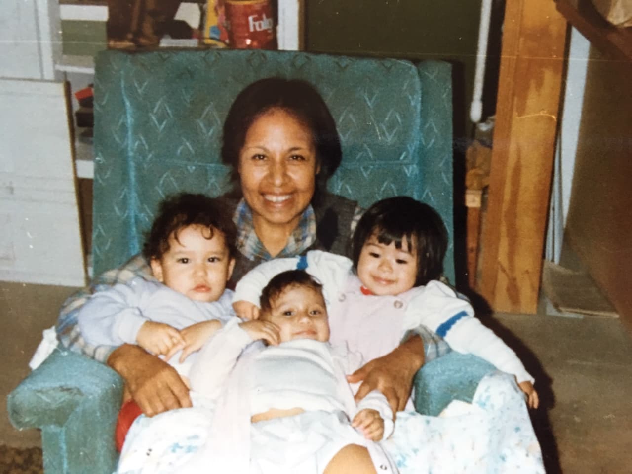 Maria Polinske with the adopted babies: Amanda, Michael and Michelle.