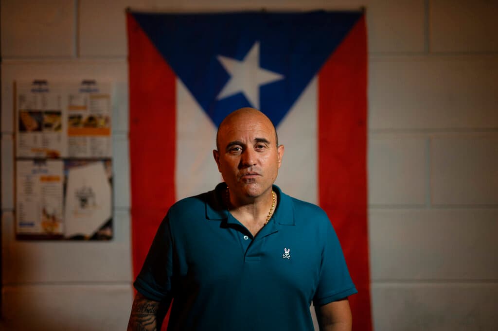 Jose Irizarry, a once-standout DEA agent sentenced to more than 12 years in federal prison for conspiring to launder money with a Colombian cartel, poses for a photo during an interview the night before going to a federal detention center, in San Juan, Puerto Rico, Wednesday, Jan. 5, 2022.