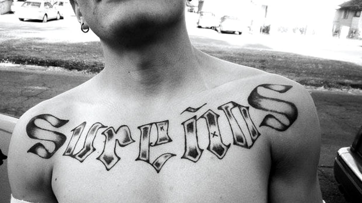 Members of a gang in Southern California wear tattoos with the word "Sureños."