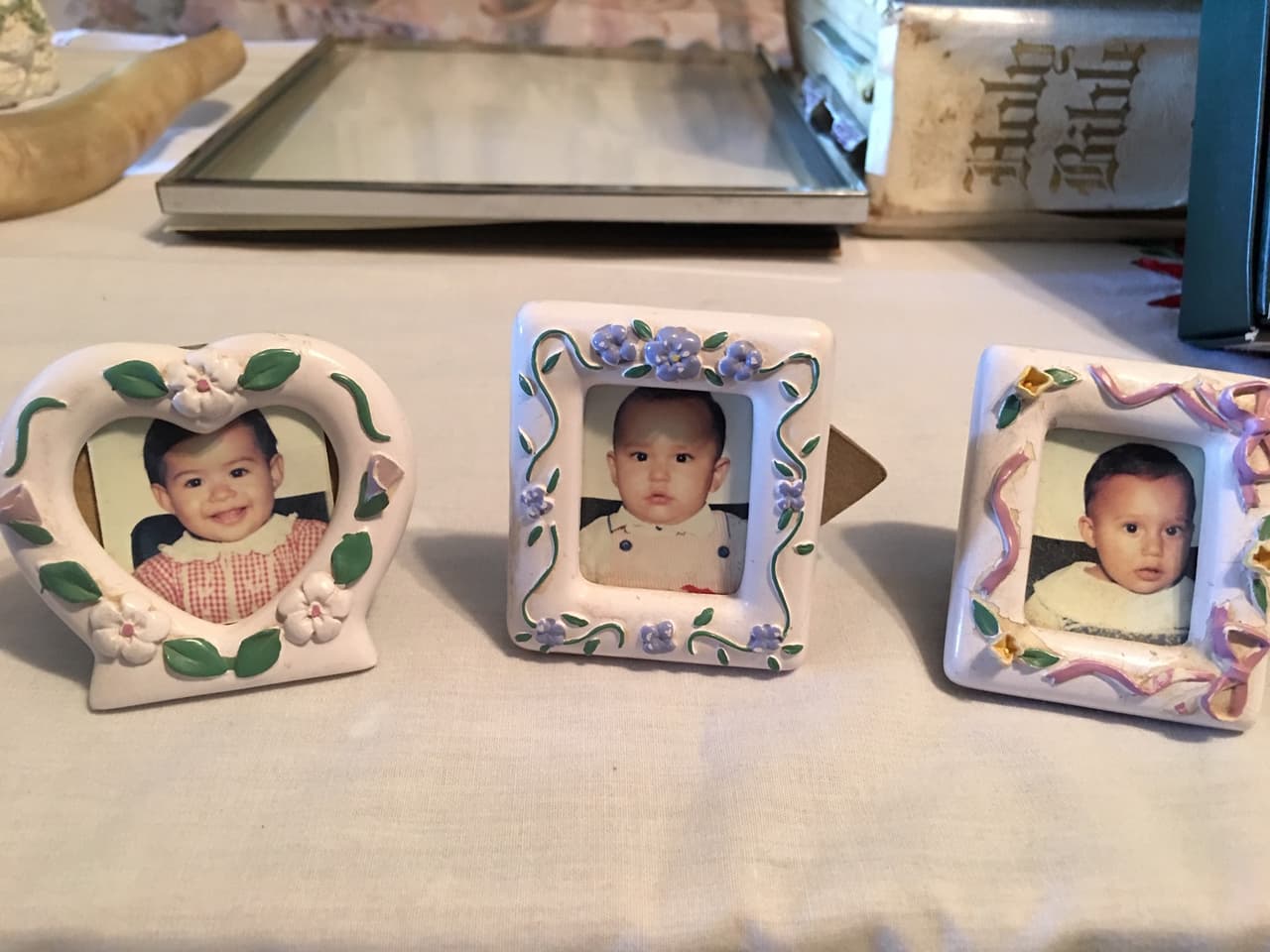 These framed passport photos of Michael, Michelle and Amanda sit at a table in Toni Polinske's living room in Midland, Texas.