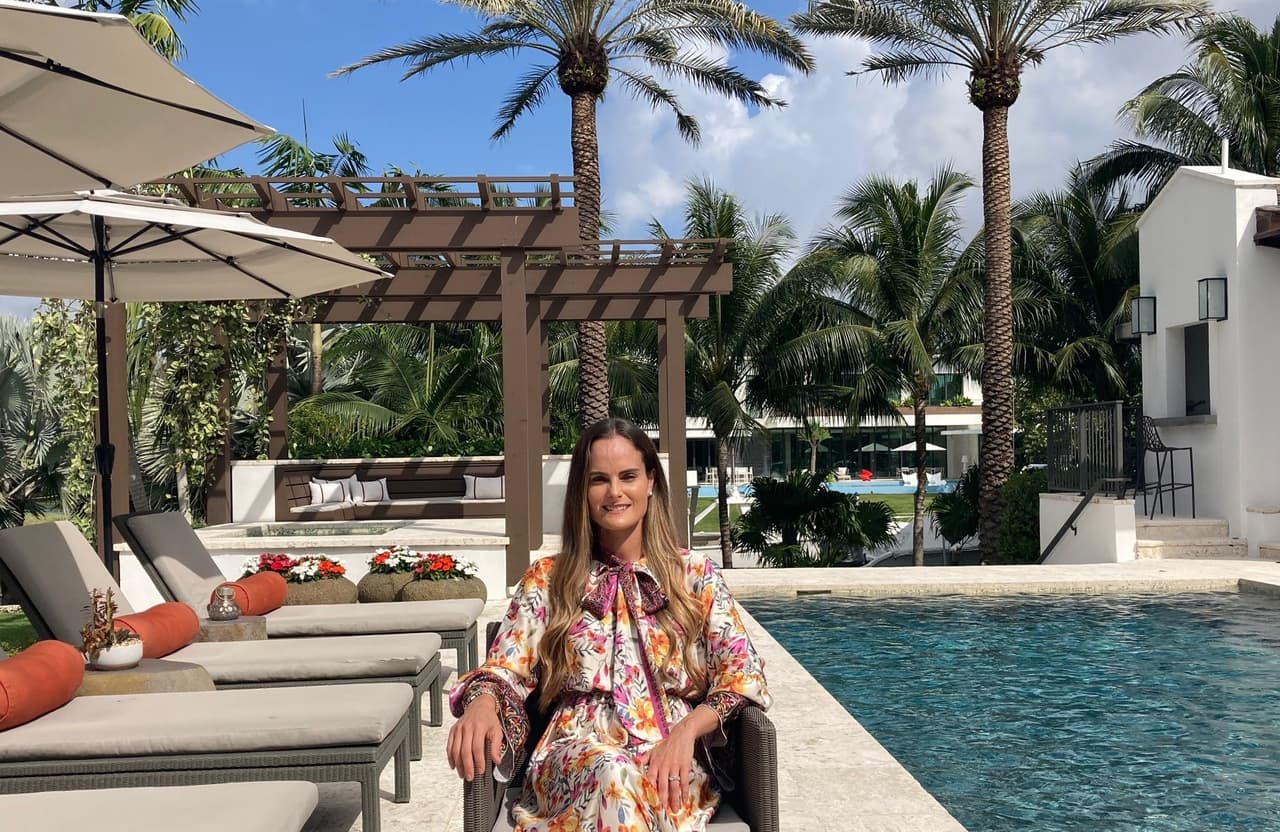 Melissa Medina, president of eMerge Americas, by the pool in her home in Coral Gables, Miami.
