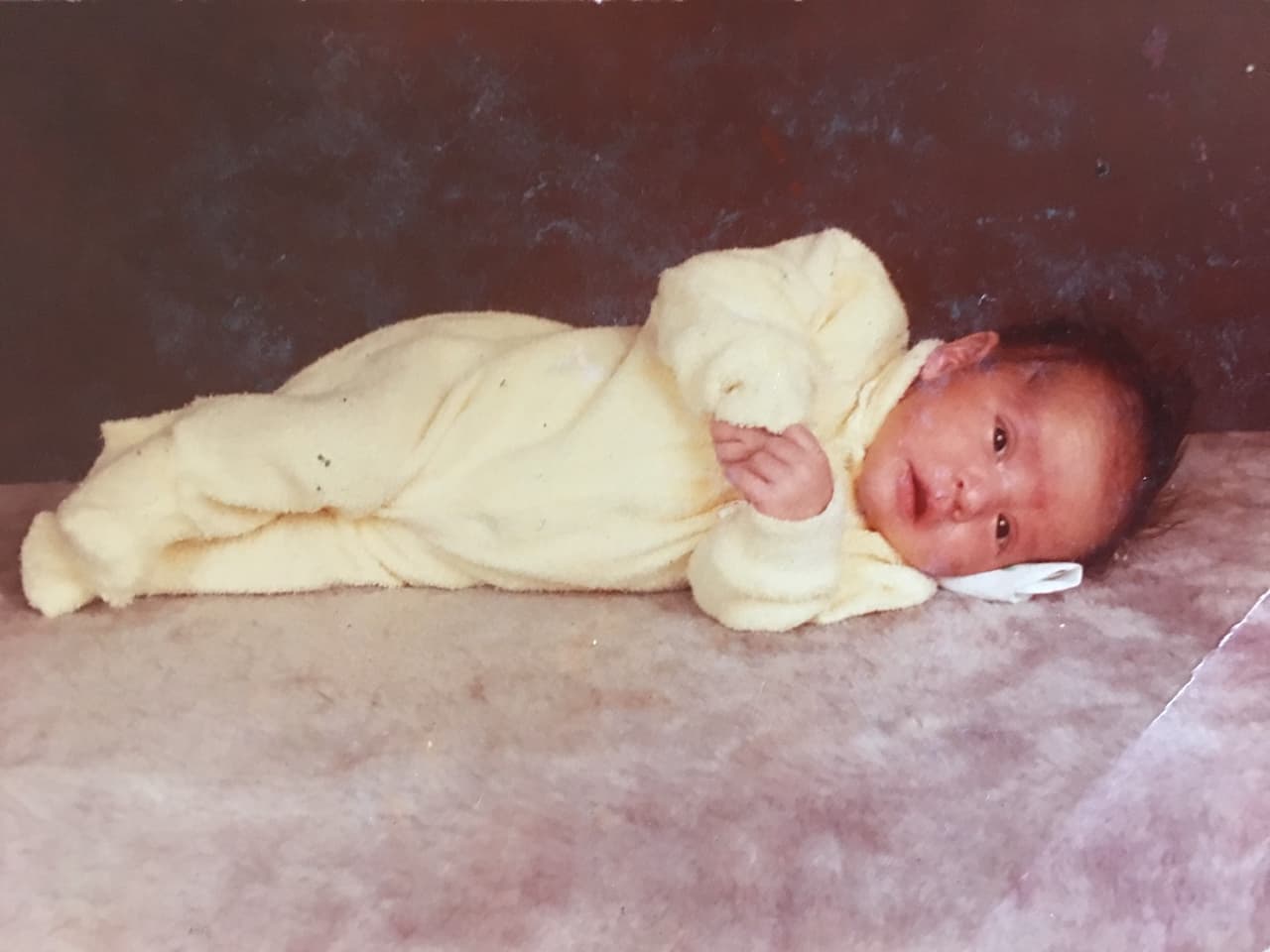 His adoptive mother recalls that Michael was a restless baby, needing attention. "My mother told me: 'Hold him close to your face, tell him your mother is here, your mother is here ... that's what I remember most," said Toni Polinske