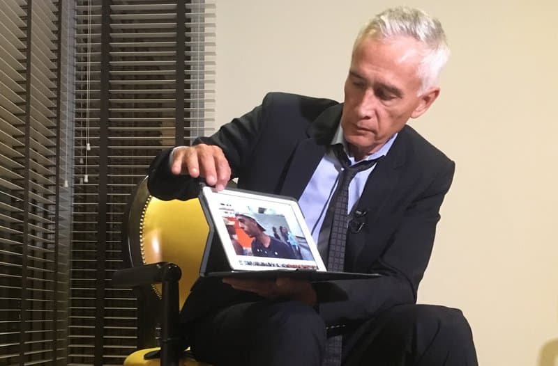 Univision’s Jorge Ramos shows a video he says his crew shot the previous day showing Venezuelan youth picking food scraps out of the back of a garbage truck in Caracas, during an interview at a hotel in Caracas, Venezuela, Monday, Feb. 25, 2019.