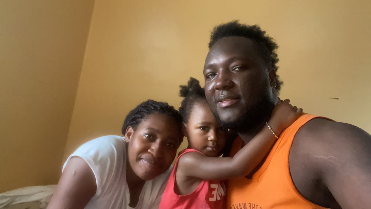 Casto Gustin, 25, with his wife Rose Mayduine Alexis and their daughter May-Caïna after arriving in Rhode Island last month.