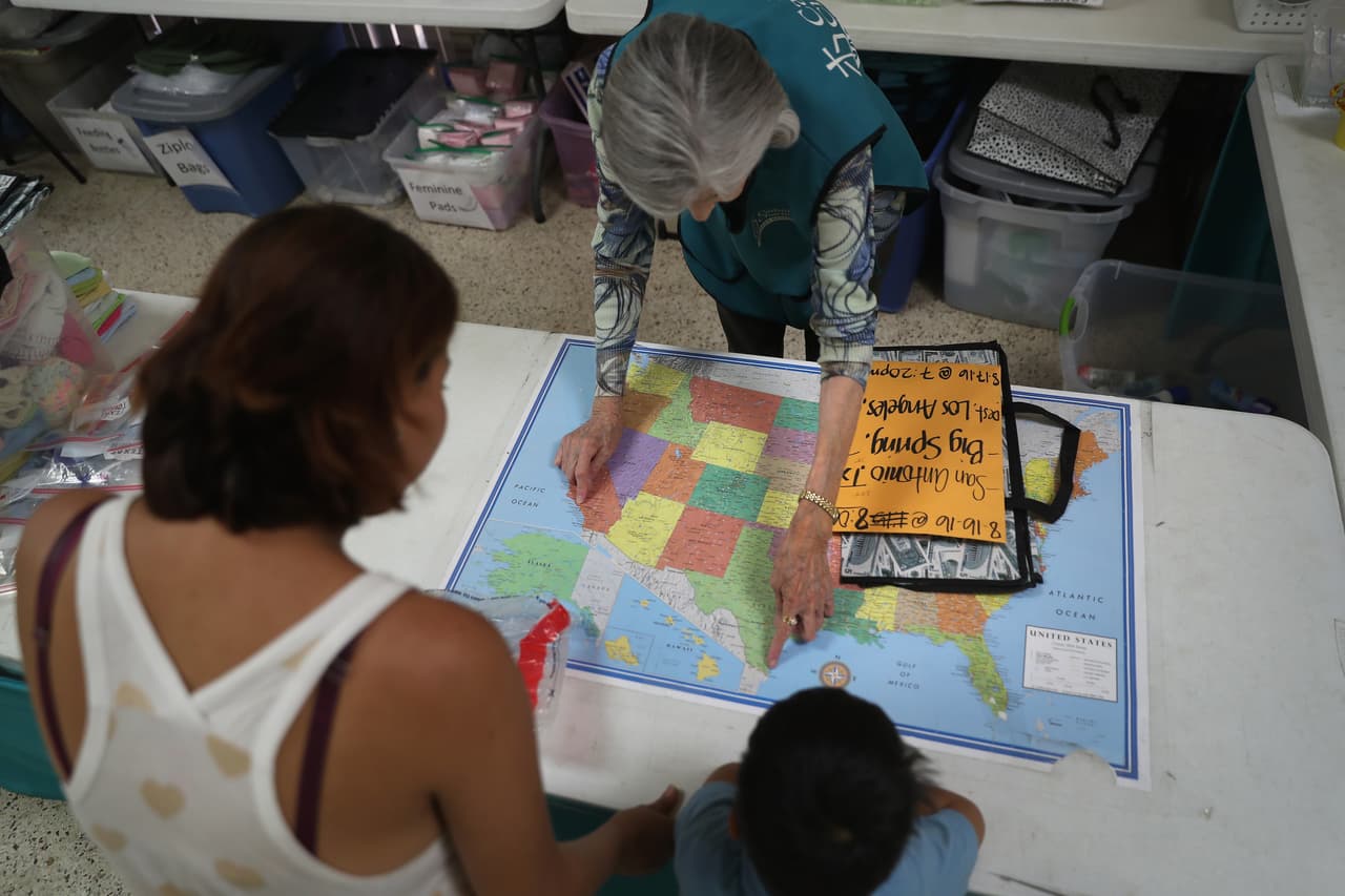 The Obama administration has deported more than 2.7 million undocumented immigrants since January 2009. In this August 15 photo, a Salvadoran family gets directions at an immigrant assistance center run by the Catholic Church of the Sacred Heart, in McAllen, Texas.