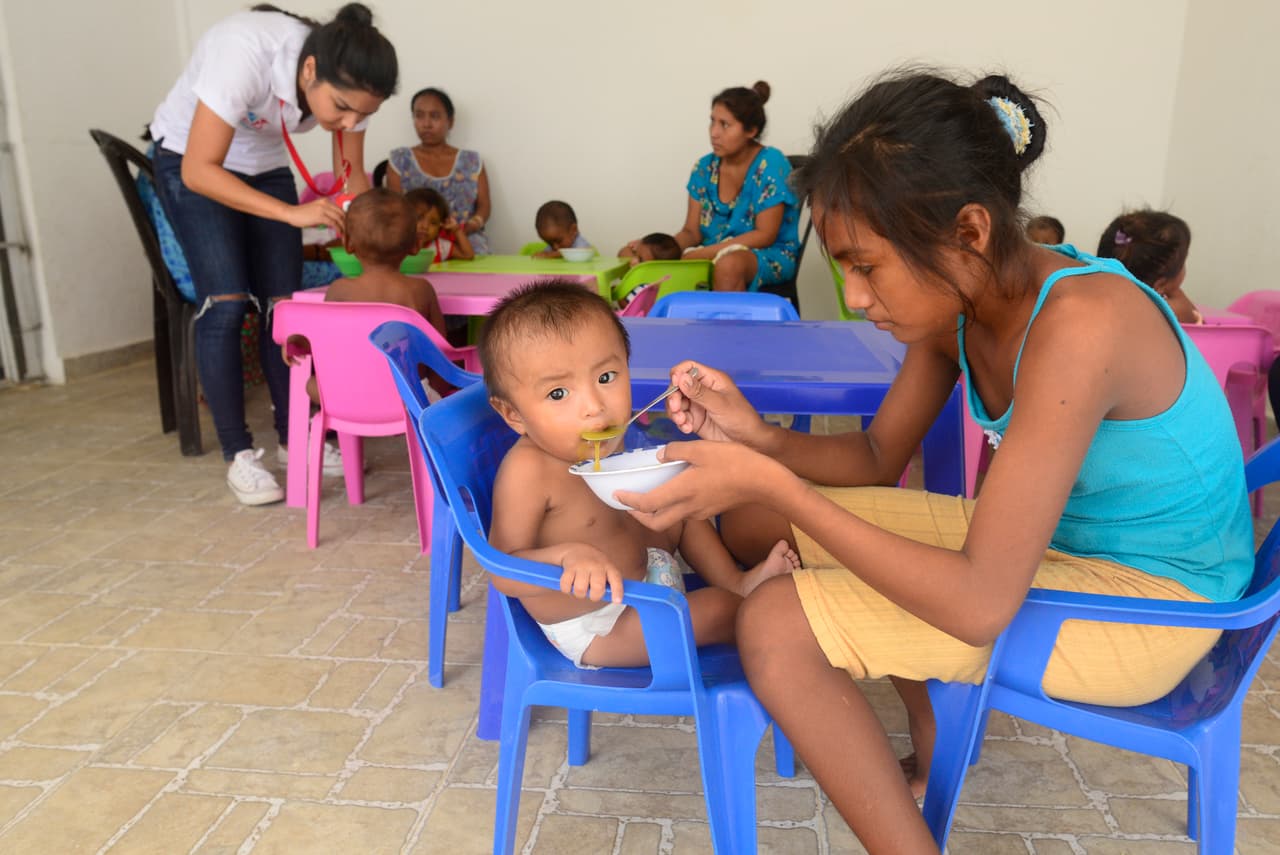 Malnourished children are fed lunch by family members at the Aporta tu granito foundation outside of Riohacha, Colombia. The foundation has seen an increase in patients since the drought.