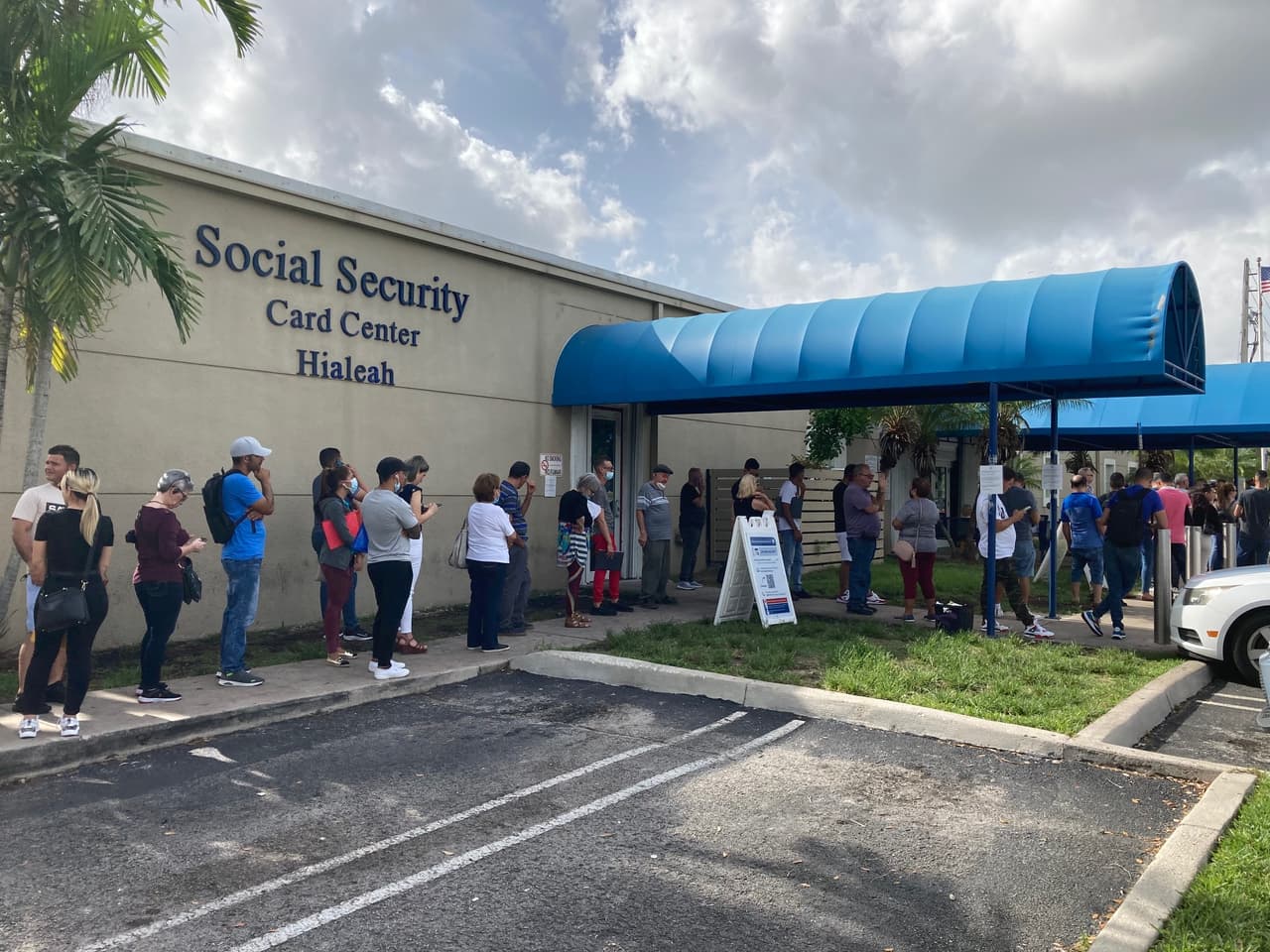 Migrants, mostly Cubans, lining up outside the Social Security office in Hialeah to obtain a temporary Social Security card that allows them to receive benefits such as food staps and cash assistance.
