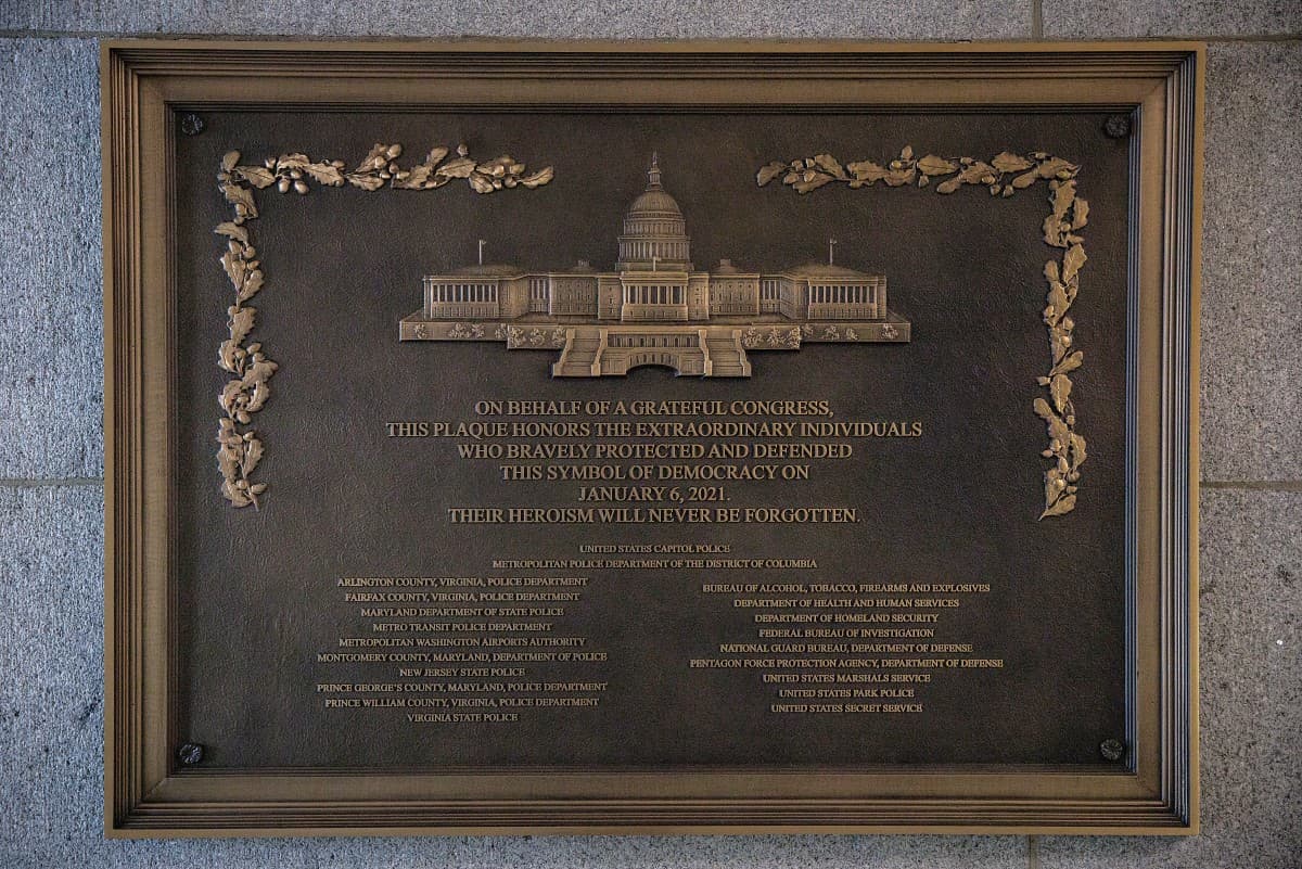 WASHINGTON, DC - MARCH 7: A plaque honoring the various law enforcement organizations that responded to the January 6th Insurrection is seen mounted next to one of the primary entrances that saw clashes between law enforcement and the insurrectionists on March 7, 2026 in Washington, DC. The plaque was supposed to be in place by March 2023 but Speaker Johnson delayed the installation of the plaque. Samuel Corum/Getty Images/AFP (Photo by Samuel Corum / GETTY IMAGES NORTH AMERICA / Getty Images via AFP)