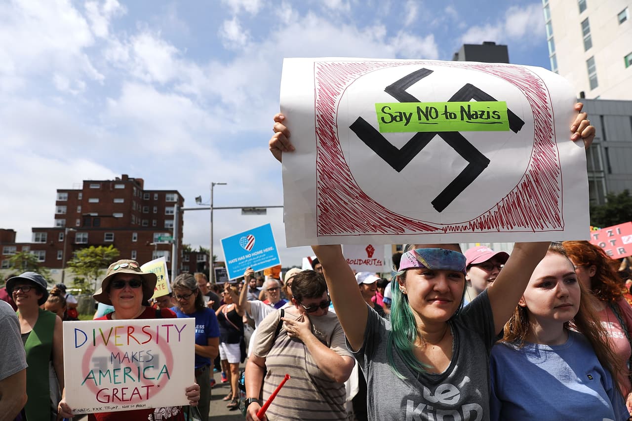 <b>"Say NO to Nazis."</b> A march for free speech in Boston was drowned out by a protest against racism and hate.