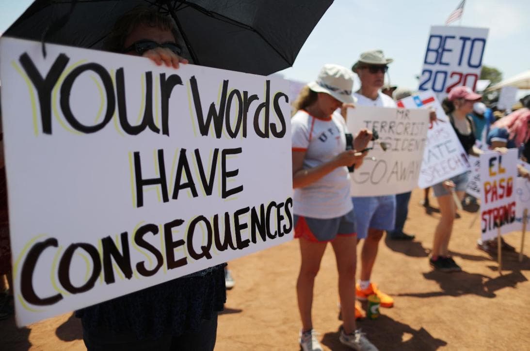 "Your words have consequences," reads a poster in El Paso after the massacre targeting Hispanics in a Walmart, Aug 3, 2019.