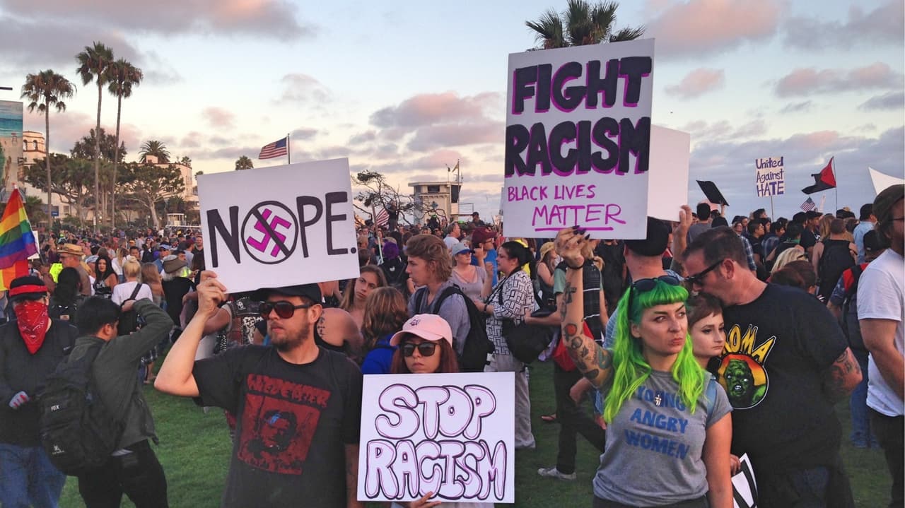 Counter-protesters carried anti-racism signs.