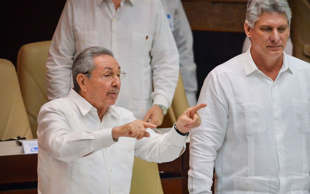 Cuban President Raul Castro (L) gestures next to first vice-president Miguel Diaz-Canel (R) at the end of the Parliament Annual Session, on December 20, 2014 in Havana.