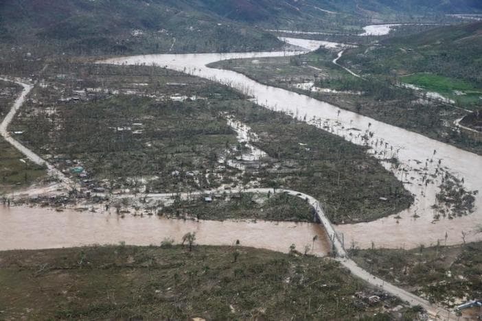 A flooded river and destroyed houses are seen after Hurricane Matthew passes Jeremie, Haiti, October 5, 2016.