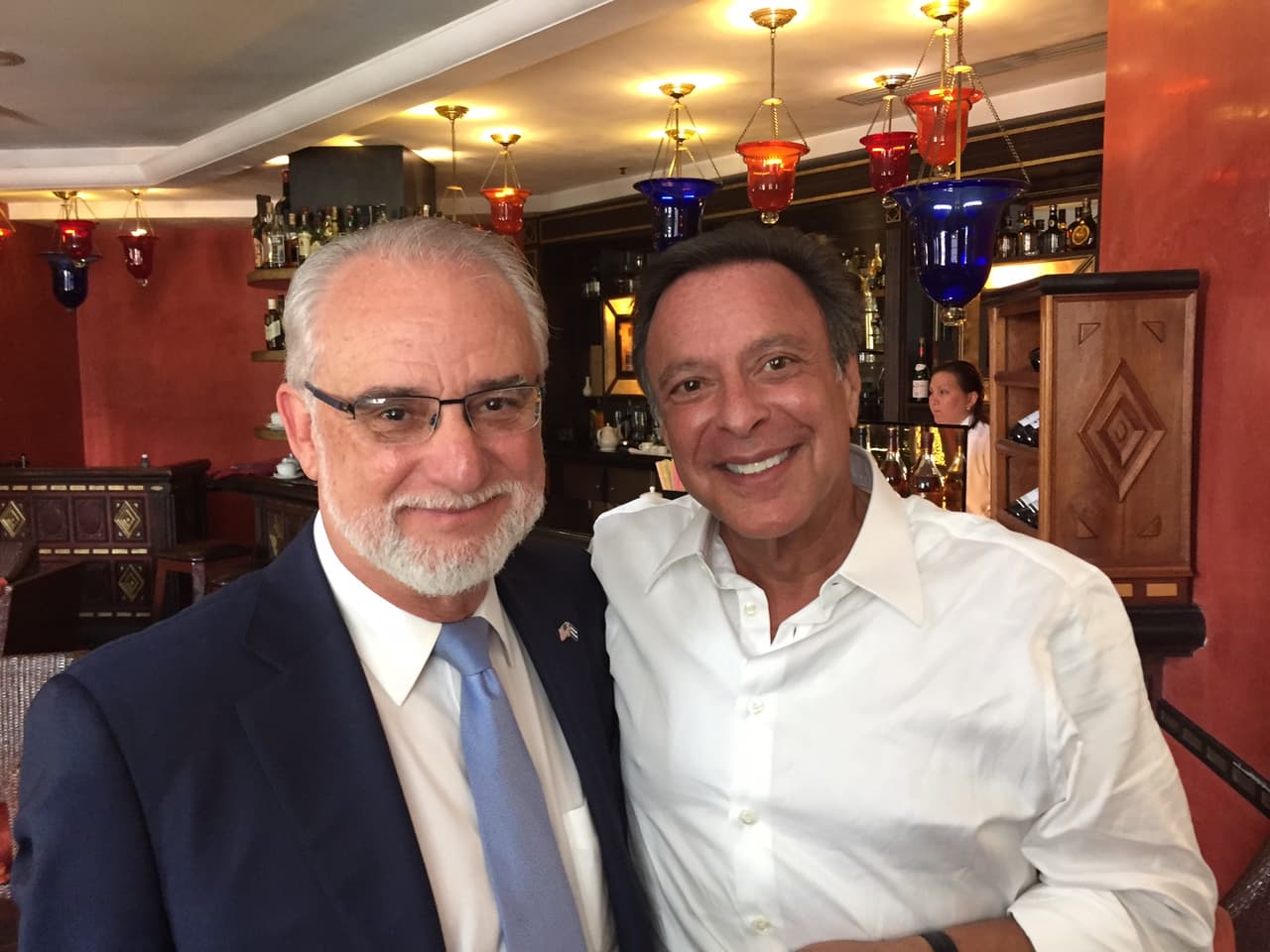 Cuban Americans celebrate Obama's speech at the Hotel Saratoga in Havana. Left to right, Pedro Freyre, Mike Fernandez