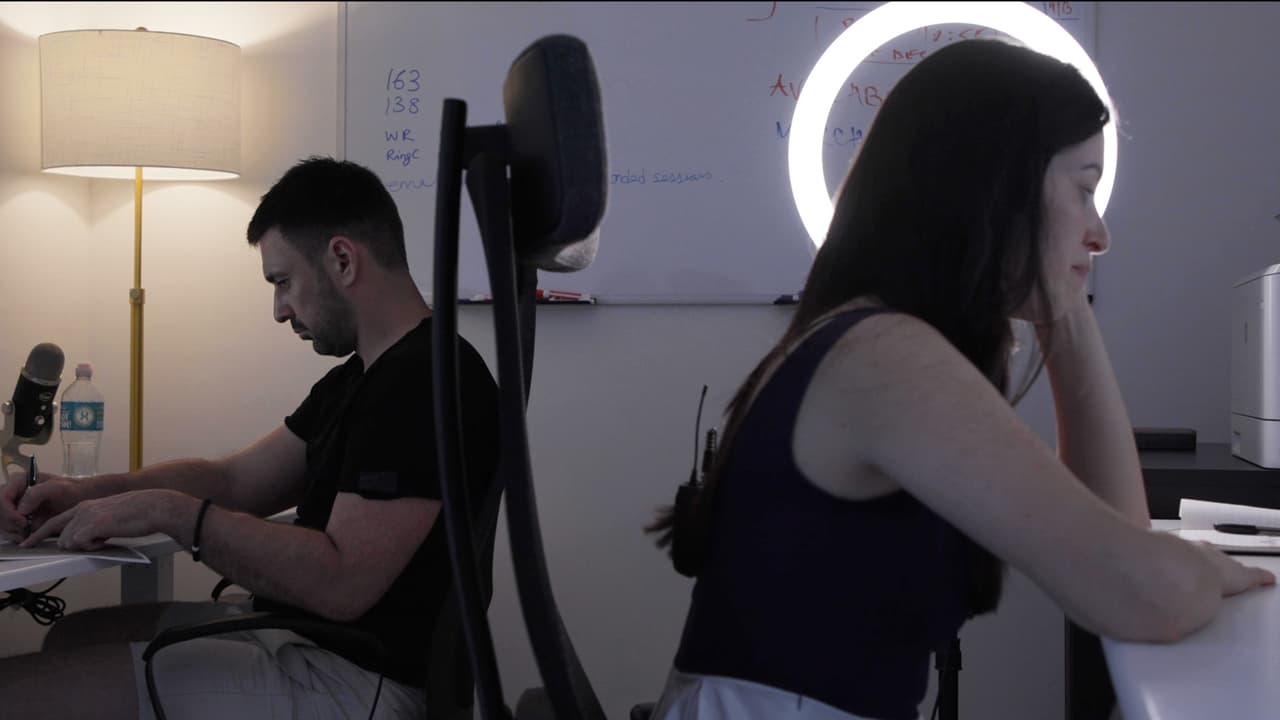 Anisa Mirza and Uros Miljkovic working in their home office in Miami.