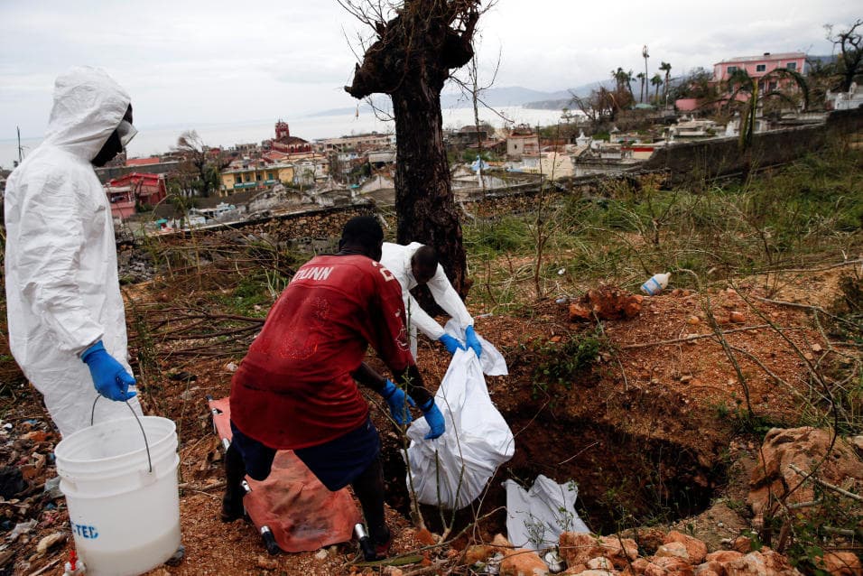 Volunteers bury the dead in Jeremie one of the hardest hit citiies in Haiti's southwest