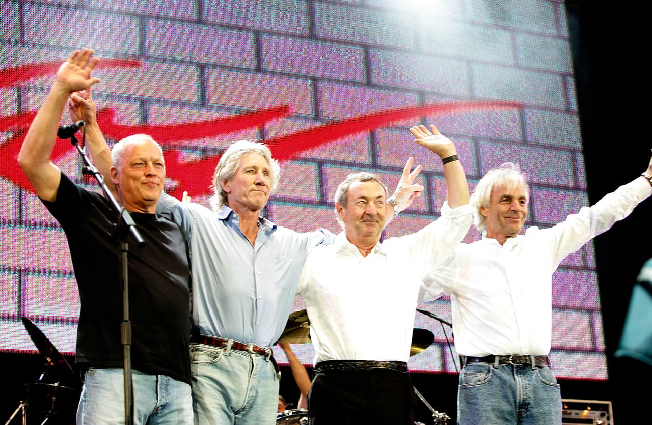 LONDON - JULY 02: (L to R) David Gilmour, Roger Waters, Nick Mason and Rick Wright from the band Pink Floyd on stage at 'Live 8 London' in Hyde Park on July 2, 2005 in London, England. The free concert is one of ten simultaneous international gigs including Philadelphia, Berlin, Rome, Paris, Barrie, Tokyo, Cornwall, Moscow and Johannesburg. The concerts precede the G8 summit (July 6-8) to raising awareness for MAKEpovertyHISTORY. (Photo by MJ Kim/Getty Images)